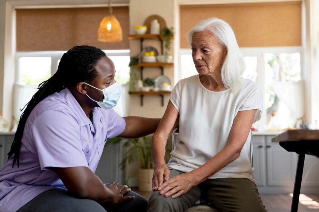 Support worker helping a woman at home